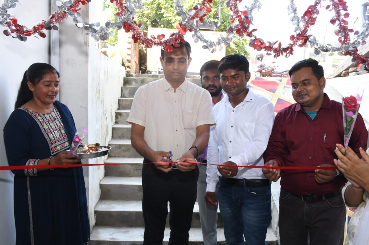 Dr. Bangali with a patient in the consultation room